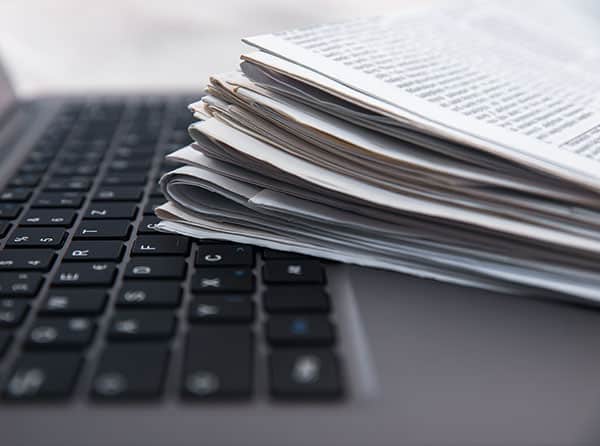 newspapers on a computer keyboard