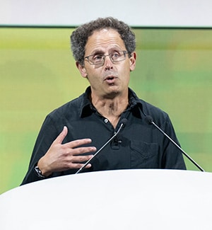 Benjamin Cravatt, PhD, speaking at a podium at the AACR Annual Meeting 2024 during the Opening Plenary.