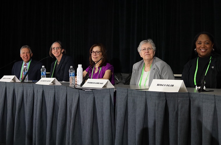 Panelists seated behind a table at the “The Cancer Moonshot: Opportunities to Fulfill the Vision of the National Cancer Plan” during the AACR Annual Meeting 2024. From left to right: Roy S. Herbst, MD, PhD, NCI Director W. Kimryn Rathmell, MD, PhD, Elizabeth M. Jaffee, MD, FAACR, AACR President Patricia M. LoRusso, DO, PhD (hc), FAACR, and Bianca N. Islam, MD, PhD.