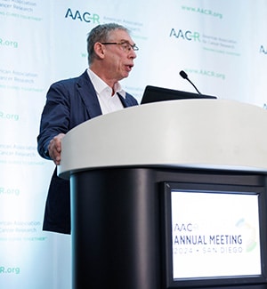 Olivier Lantz, MD, PhD, presenting his study on cancer vaccines at a press conference at AACR Annual Meeting 2024.