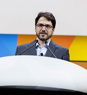 Daniel De Carvalho, PhD, at a podium on stage during the plenary "Discovery Science in Early Cancer Biology and Interception" at the AACR Annual Meeting 2024.