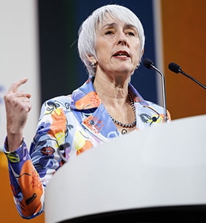 Margaret Goodell, PhD, FAACR, at a podium on stage during the plenary "Discovery Science in Early Cancer Biology and Interception" at the AACR Annual Meeting 2024.