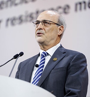 Michael Kastan, MD, PhD, FAACR, at a podium on stage during a plenary at the AACR Annual Meeting 2024.